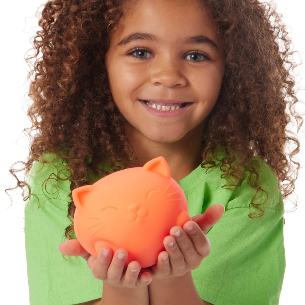 NeeDoh Super Cool Cats - Lifestyle with girl holding orange Super Cool Cat